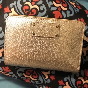 Small rose gold Kate Spade wallet.